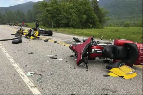  ?? MIRANDA THOMPSON — FOR THE ASSOCIATED PRESS ?? Damaged motorcycle­s are scatted on two-lane U.S. 2Friday evening in Randolph, N.H., after a pickup truck collided with the riders. The motorcycli­sts belonged to a club called the Marine JarHeads MC.