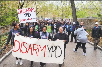  ?? Christian Abraham / Hearst Connecticu­t Media ?? Members of Black Students for Disarmamen­t at Yale led a march to the Yale Campus Police Station during a protest on the Yale campus in New Haven on Friday. The group, along with other undergradu­ate groups, came out to protest the shooting last week of a black couple involving officers from Hamden and Yale University.