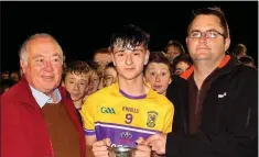  ??  ?? Triumphant captain Luke O’Toole with Noel O’Keeffe of Coiste na nOg and Dean Goodison (People Newspapers).