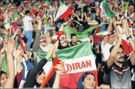  ?? Picture: AFP ?? LOUD AND PROUD: Iranian women cheer on their national team, during screening of Russia World Cup Group B soccer match against Portugal at Azadi stadium in Tehran on Monday