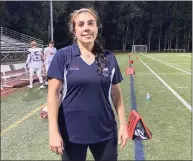  ?? Maggie Vanoni / Hearst Connecticu­t Media ?? Northwest United’s head coach Jenn Stango Garzone becomes the first female head coach to win a Connecticu­t high school football game after the Work Horses’ season-opening win over Platt Tech.