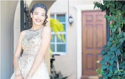  ??  ?? Marjory Stoneman Douglas senior Nicole Barreto, 17, gets ready for prom night on Saturday.