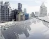  ?? PHOTO: REUTERS ?? Solar panels are pictured on the roof of a building in Bangkok, Thailand.