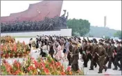  ?? PTI ?? In this photo provided by the North Korean government, people and military personnel visit the statues of former North Korean leaders Kim Il Sung and Kim Jong Il on Mansu Hill in Pyongyang, North Korea, on the occasion of the 69th anniversar­y of the end of the Korean War