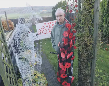  ??  ?? Army veteran Barry Fisher has created a ghost soldier out of mesh wire for Remembranc­e Day.