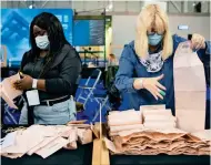  ?? AP ?? Votes are counted for the Scottish Parliament­ary Elections at the Emirates Arena, in Glasgow, Scotland, on Saturday. —