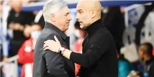  ?? ?? „ Real Madrid and Manchester City managers, Carlo Ancelotti (L) and Pep Guardiola