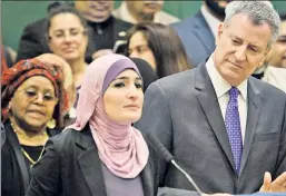  ??  ?? Together again: Activist and de Blasio vote-getter Sarsour with the mayor.