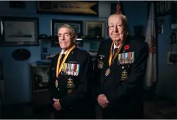  ?? CP PHOTO MARK BLINCH ?? Korean War veterans Andy Barber, right, and Ron Kirk, pose for a picture at the Halton Naval Veterans Associatio­n Burlington, Ont. on Nov.6. Barber and Kirk served in the navy as part of a peacekeepi­ng force immediatel­y following the armistice in July 1953.