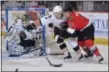  ?? PHOTO BY ANDY CAMP ?? Peter MacArthur, right, of Clifton Park, brings veteran leadership to the Adirondack Thunder, which are fighting hard to make the ECHL playoffs.