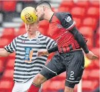  ??  ?? Up in the air: Elgin’s Matthew Cooper, right, outjumps Josh Doig of Queen’s Park at Hampden on Saturday