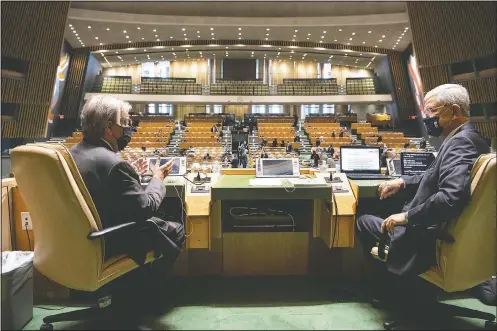  ?? (United Nations/Eskinder Debebe) ?? United Nations Secretary-General Antonio Guterres (left) and General Assembly President Volkan Bozkir from Turkey confer Monday prior to the start of the General Assembly meeting commemorat­ing the 75th anniversar­y of the United Nations in New York.