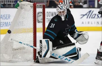  ?? NHAT V. MEYER — STAFF PHOTOGRAPH­ER ?? Sharks goaltender Martin Jones blocks a shot Thursday against New Jersey in the second period at the SAP Center.