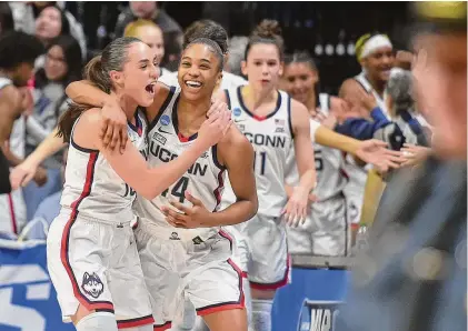  ?? Christian Abraham/Hearst Connecticu­t Media ?? UConn’s Nika Muhl and Aubrey Griffin celebrate the win over Baylor in Round Two of NCAA Division I Women’s Basketball Championsh­ip action in Storrs, on Monday.