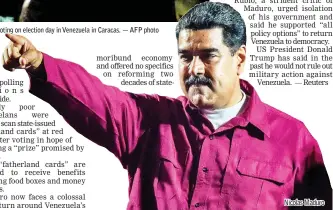  ??  ?? Maduro addresses supporters after the National Electoral Council (CNE) announced the results of the voting on election day in Venezuela in Caracas. — AFP photo Nicolas Maduro