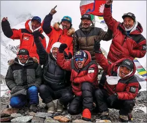  ??  ?? SUMMIT SPECIAL: Nirmal Purja (third from left, bottom row) and fellow climbers