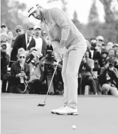  ??  ?? Dustin Johnson putts on the 18th hole during the final round at the Genesis Open at Riviera Country Club in Pacific Palisades, California in this Feb 19 file photo. — AFP photo