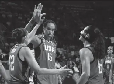  ?? Associated Press ?? Up top: Brittney Griner of the United States celebrates with teammates during the Women's basketball World Cup semifinal match against Belgium. in Tenerife, Spain, Saturday. The Americans won 93-77.