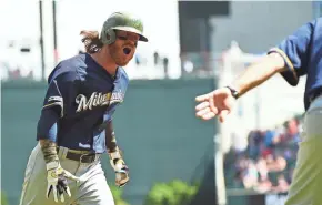  ?? GETTY IMAGES ?? The Brewers’ Ben Gamel is pumped up after hitting a home run in the 10th inning against the Braves on Sunday.