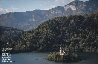  ?? PHOTO: FLASH 90 ?? The church in the centre of Lake Bled, a popular Slovenian hiking spot