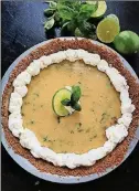  ?? GRETCHEN MCKAY/PITTSBURGH POST-GAZETTE/TNS ?? Cool and creamy, lime pie studded with bits of basil hits the spot on a hot summer night.