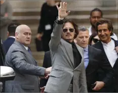  ?? AP PHOTO/ALASTAIR GRANT ?? In this July 28, 2020 file photo, American actor Johnny Depp, waves as he leaves after the end of the trial at the High Court in London. The UK High Court has ruled against Johnny Depp in his libel suit against the owner of the Sun newpaper over wife-beating allegation, it was reported on Monday.