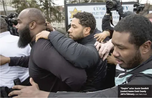  ?? SUN-TIMES FILES ?? “Empire” actor Jussie Smollett (center) leaves Cook County Jail in February.