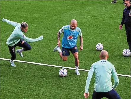  ?? — AFP ?? Calm before the storm: brazil veteran dani alves (centre) training with teammates at the Continassa training ground in Turin, italy, ahead of the World Cup.