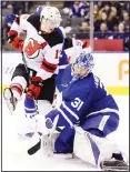  ??  ?? Toronto Maple Leafs goaltender Frederik Andersen (31) looks back as the puck goes in, next to New Jersey Devils center Nico Hischier (13) during the third period of an NHL hockey game on Jan
14, in Toronto. (AP)