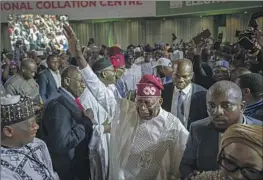  ?? Ben Curtis Associated Press ?? PRESIDENT-ELECT Bola Tinubu greets supporters Wednesday in Abuja, Nigeria’s capital, after election officials declared he had won with 37% of the vote.