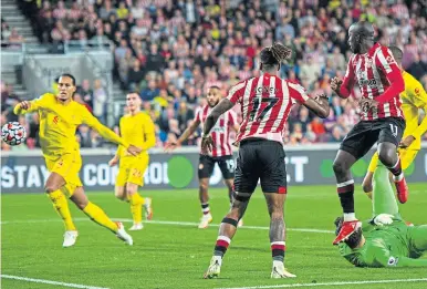  ?? ?? Yoane Wissa (far right) equalises for Brentford to deny Liverpool victory in a pulsating encounter