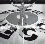  ??  ?? Robert Indiana poses with the MECCA floor he designed, as seen in a Journal Sentinel file photo from October 1977.