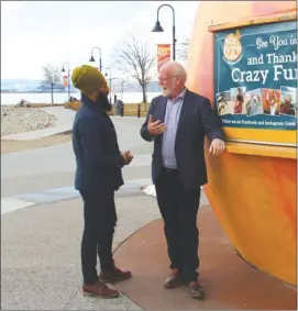  ?? Contribute­d/Twitter/Richard Cannings: ?? Federal NDP leader Jagmeet Singh and NDP MP Richard Cannings talk shop Friday at the Peach on the Beach in Penticton.