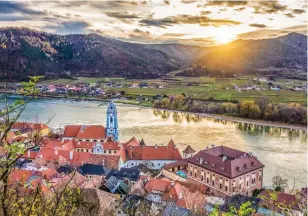  ??  ?? Austrian contrasts: Wine-producing Durnstein, in the Wachau Valley, left; Vienna, the capital, above, city of music and replete with fascinatin­g history