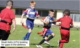  ??  ?? Noah Kelly (U7s) looking for gaps in the defence
