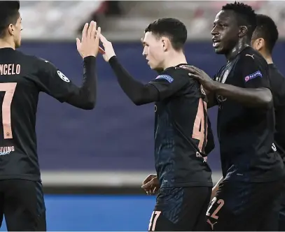 ?? Picture: AFP ?? GOOD STUFF. Manchester City’s Phil Foden (centre) is congratula­ted by team-mates after scoring a goal during their Champions League group match against Olympiakos in Piraeus on Wednesday night.