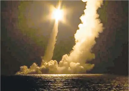  ?? RUSSIAN DEFENSE MINISTRY PRESS SERVICE VIA AP ?? Interconti­nental ballistic missiles are launched by the Vladimir Monomakh nuclear submarine of the Russian navy from Russia’s Sea of Okhotsk on Saturday. The submarine successful­ly test-fired four interconti­nental ballistic missiles.