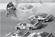  ?? [AP PHOTO/GREG SUVINO, FILE] ?? Dale Earnhardt's (3) window pops out of the car after being hit by Ken Schrader (36) during the Daytona 500 on Feb. 18, 2001. On the cusp of a national popularity explosion, NASCAR never stopped after the deaths of Adam Petty, Kenny Irwin Jr. and Tony Roper. But losing Earnhardt forced the stock car series to confront safety issues it had been slow to even acknowledg­e, let alone address. The dramatic upgrades have saved multiple lives.