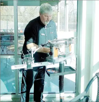  ?? Lynn Atkins/The Weekly Vista ?? The POA’s new tennis manager, Jake Shoemake, restrings a racket at the tennis center near Riordan Hall. It’s a skill he learned as a teenager when he was constantly breaking rackets during competitio­n. Shoemake grew up in the area and returned recently...