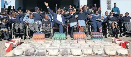  ?? Picture: SIBONGILE NGALWA ?? GROWING THE LOVE: East London businessme­n Mandla Dlokweni of Mandla Constructi­on celebrated his 50th birthday differentl­y yesterday by giving out 50 cakes, chicken and cooldrinks to charities and schools around East London