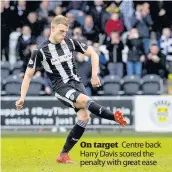  ??  ?? On target Centre back Harry Davis scored the penalty with great ease