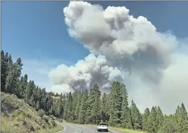  ?? Anjeanette Damon Reno Gazette-Journal ?? SMOKE RISES from the Hog fire near Susanville, Calif., on Sunday. Officials say the blaze, which began July 18, was 38% contained as of Friday morning.