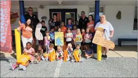  ?? BILL RETTEW - MEDIANEWS GROUP ?? Gifted shoes put smiles on the faces of children at West Chester Area Day Care Center.