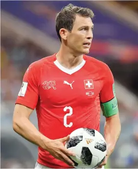  ?? Picture: AFP ?? BLOW. Swiss captain Stephan Lichtstein­er will miss the last-16 clash with Sweden due to suspension.