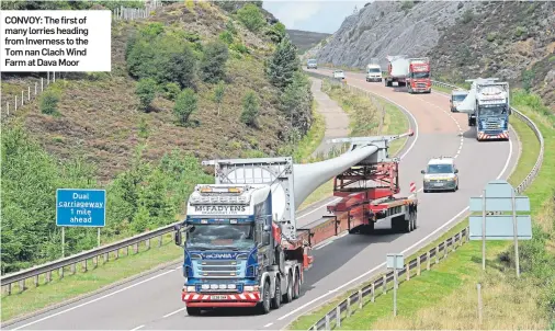  ??  ?? CONVOY: The first of many lorries heading from Inverness to the Tom nan Clach Wind Farm at Dava Moor