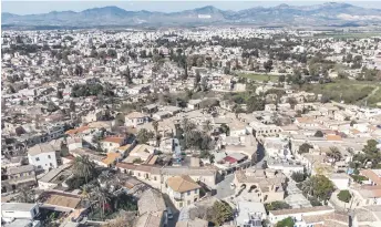  ?? ?? Aerial photo shows a view of the old city of Cyprus’ divided capital Nicosia, showing the section under control of the internatio­nally-recognised Republic of Cyprus (foreground), the United Nations buffer zone (centre), and the selfprocla­imed “Turkish Republic of North Cyprus” recognised only by Turkey.