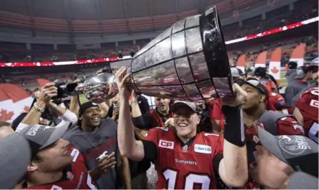  ?? NATHAN DENETTE/THE CANADIAN PRESS FILE PHOTO ?? Don’t be surprised if quarterbac­k Bo Levi Mitchell and the Calgary Stampeders raise the Grey Cup again this season.