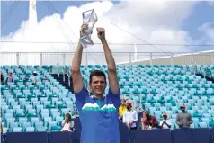  ?? The Associated Press ?? ■ Hubert Hurkacz of Poland poses with the trophy after defeating Yannik Sinner of Italy during the finals of the Miami Open tennis tournament Sunday in Miami Gardens, Fla. Hurkacz won 7-6 (4), 6-4.