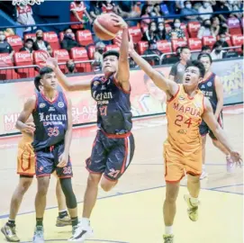  ?? PHOTOGRAPH COURTESY OF NCAA ?? LOUIE Sangalang of Letran College beats Toby Agustin of Mapua University for the rebound in their Season 98 NCAA basketball game yesterday. The Knights won, 74-58.