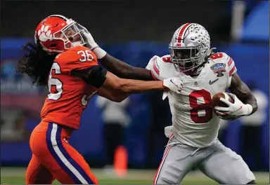  ?? (AP/Gerald Herbert) ?? Ohio State running back Trey Sermons (right) has rushed for 636 yards in the Buckeyes’ past three games entering tonight’s national championsh­ip game against Alabama.